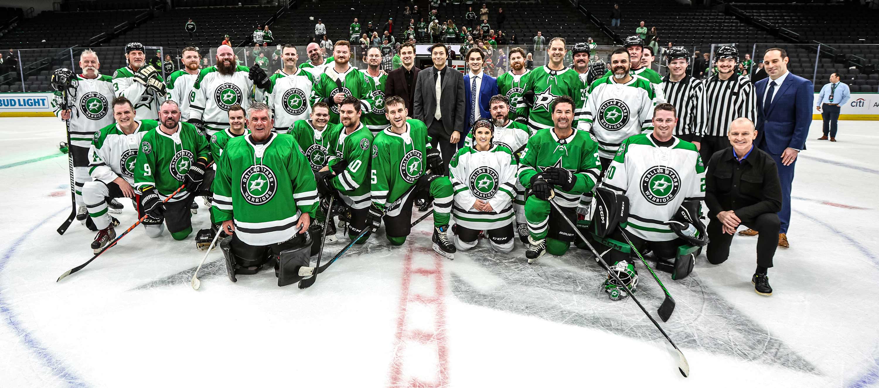 The Dallas Stars Hockey Team posing on the ice rink.